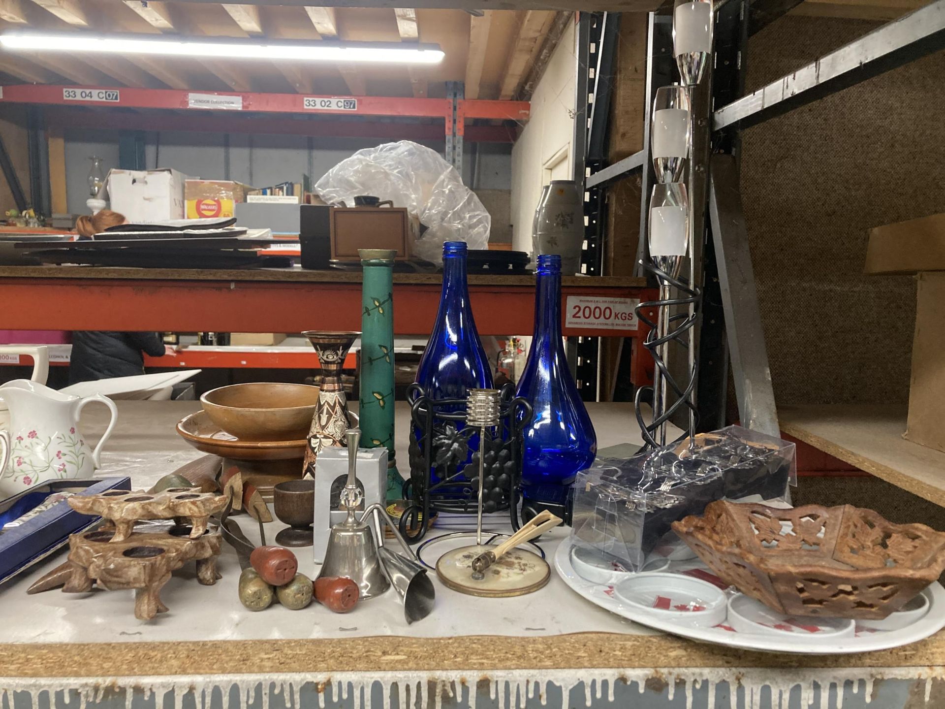 A MIXED GROUP OF ITEMS TO INCLUDE BLUE GLASS BOTTLES, TREEN BOWL, CARVED STANDS ETC