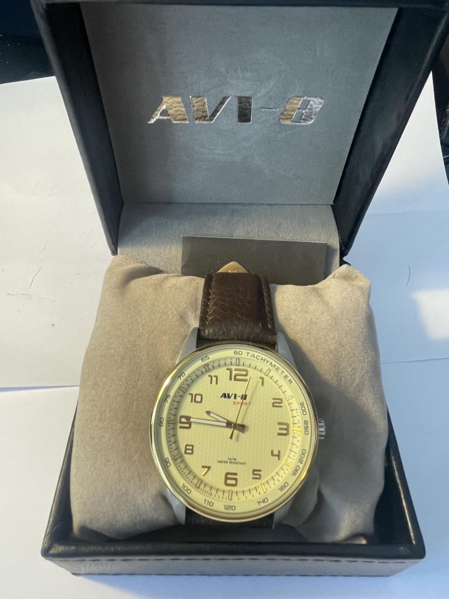 AN AS NEW AND BOXED AVI-8 SPORT TACHYMETER WATER RESISTANT WRIST WATCH SEEN WORKING BUT NO WARRANTY