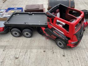 A 'SUPER CAR' BATTERY POWERED CHILDS RIDE ALONG BATTERY WAGON AND TRAILER COMPLETE WITH CHARGER,