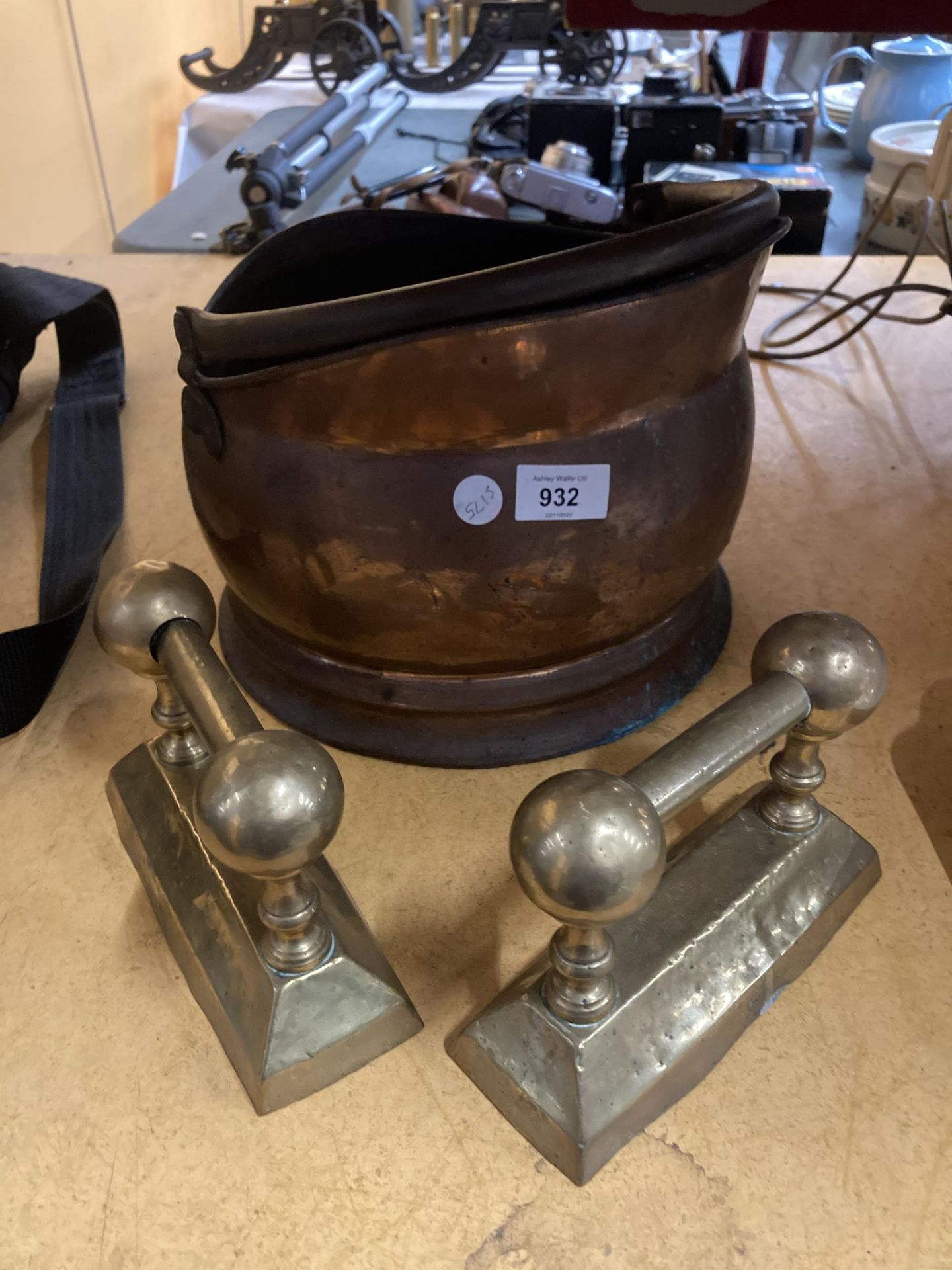 A COPPER COAL BUCKET PLUS TWO BRASS FIRE DOGS