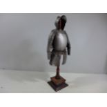 A MINIATURE REPLICA SUIT OF 17TH CENTURY ARMOUR ON A WOODEN STAND, HEIGHT 42.5CM