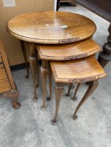 A NEST OF THREE WALNUT TABLES