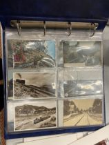 A VINTAGE POSTCARD ALBUM RELATING TO TRAINS