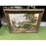 AN ORNATE GILT FRAMED OIL PAINTING OF A RIVERSIDE SCENE WITH SHIRE HORSE