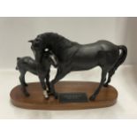 A BESWICK BLACK BEAUTY AND FOAL ON A BASE