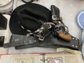 A VINTAGE, MADE IN THE USA, LEATHER HOLSTER WITH REPLICA GUN AND SPURS PLUS A HAT FROM THE RANCH
