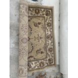 A DUNELM BEIGE PATTERNED RUG 120CM X 170CM