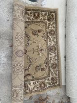 A DUNELM BEIGE PATTERNED RUG 120CM X 170CM