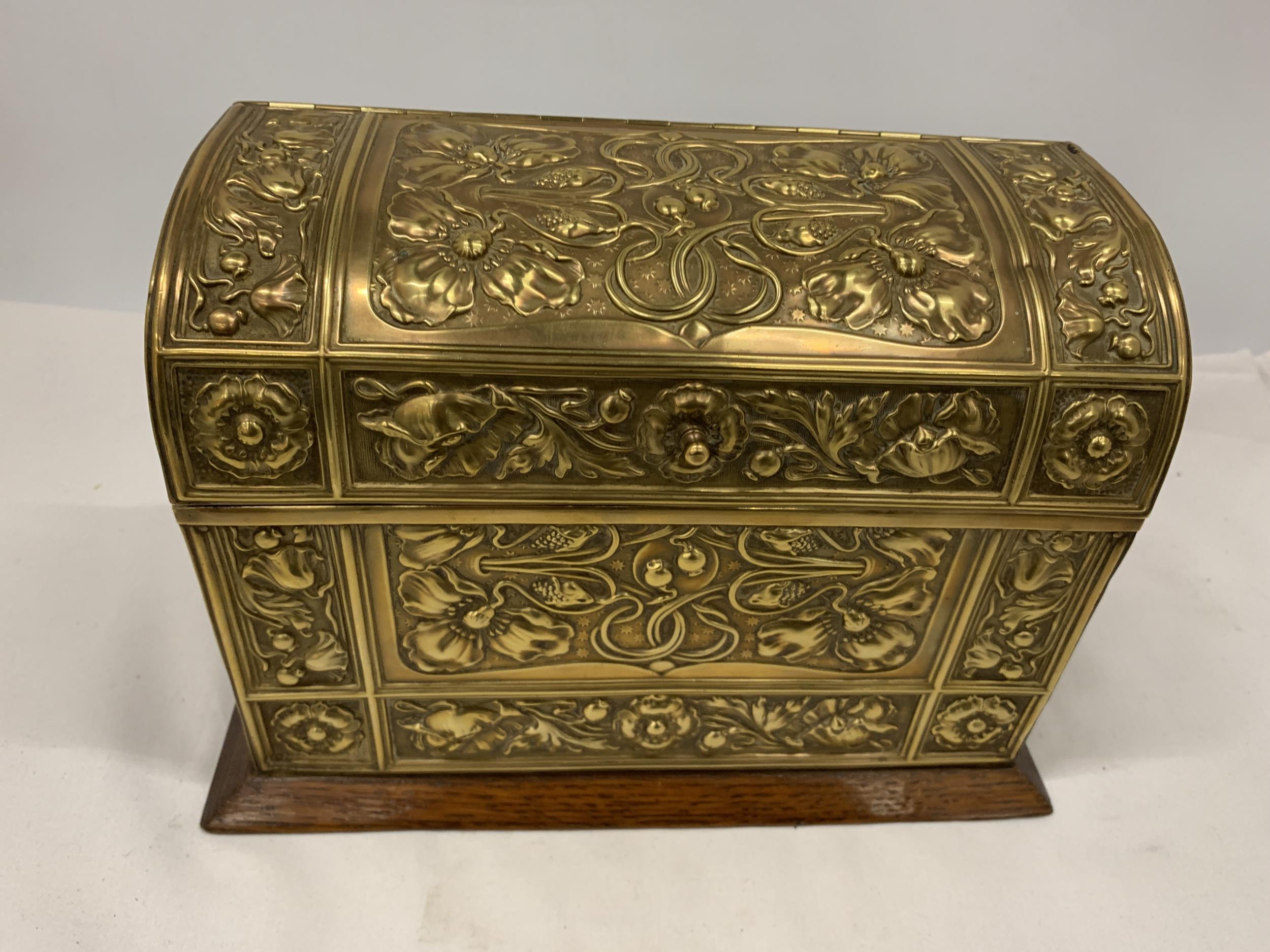 A VINTAGE OAK AND BRASS LETTER BOX