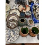 A LARGE QUANTITY OF STUDIO POTTERY TO INCLUDE VASES, PLATES AND PLANTERS, SOME SIGNED TO THE BASE