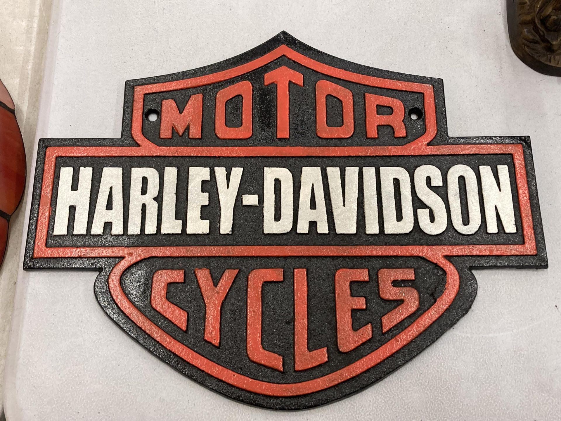 A LARGE CAST HARLEY DAVIDSON ADVERTISING SIGN, 34CM X 26CM