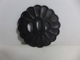A JAPANESE IRON TSUBA WITH FLORAL DECORATION, DIAMETER 8CM