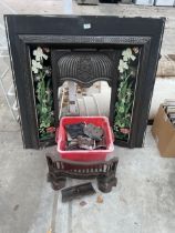 A DECORATIVE CAST IRON FIRE SURROUND AND FIRE FRONTS ETC