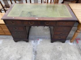 A MAHOGANY TWIN PEDESTAL DESK ENCLOSING EIGHT DRAWERS WITH INSET LEATHER TOP, 54 X 27"