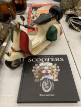 AN ITALIAN TIN PLATE SCOOTER WITH A COLOUR BOOK OF SCOOTERS