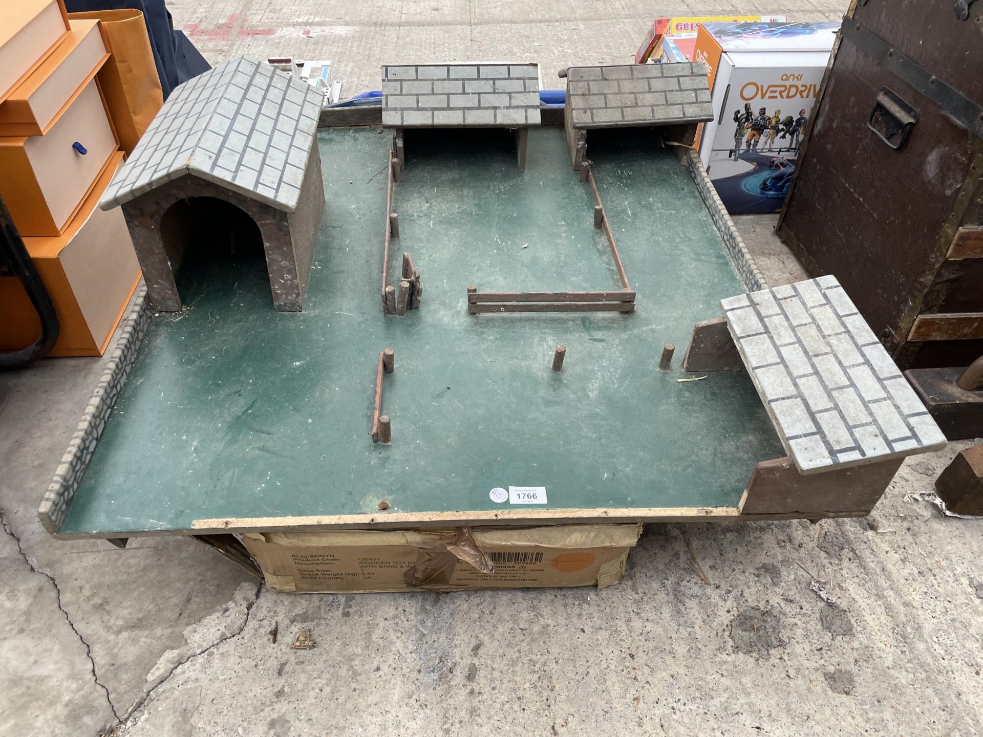 A WOODEN FARM BUILDING BOARD AND A STORAGE UNIT