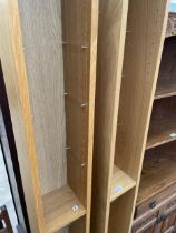 A PAIR OF MODERN NARROW SHELVES, 8" WIDE WITH TEN SHELVES EACH