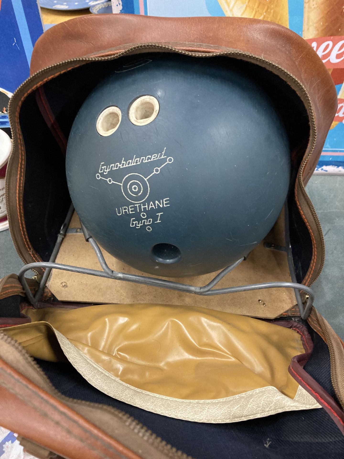 AN EBONITE GYNO - 1 TEN PIN BOWLING BOWL WITH STAND AND CASE