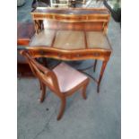 A YEW WOOD SERPENTINE FRONTED LADIES WRITING TABLE ENCLOSING FIVE DRAWERS WITH INSET LEATHER TOP,