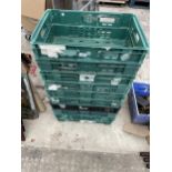 AN ASSORTMENT OF PLASTIC STACKING CRATES