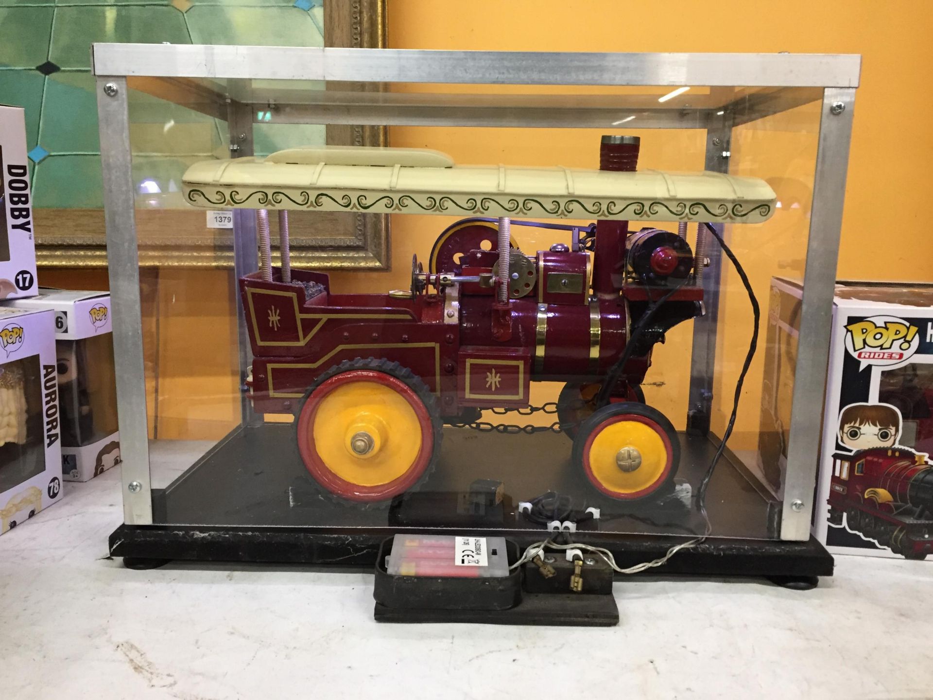 A VINTAGE WOODEN MODEL STEAM ENGINE, ON A WOODEN PLINTH BASE WITH PERSPEX DISPLAY BOX AND WITH