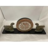 A CONTINENTAL ART DECO CLOCK ON A PLINTH WITH SQUIRREL GARNITURES 23" WIDE