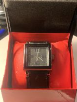 AN AS NEW AND BOXED FUBU WRISTWATCH SEEN WORKING BUT NO WARRANTY