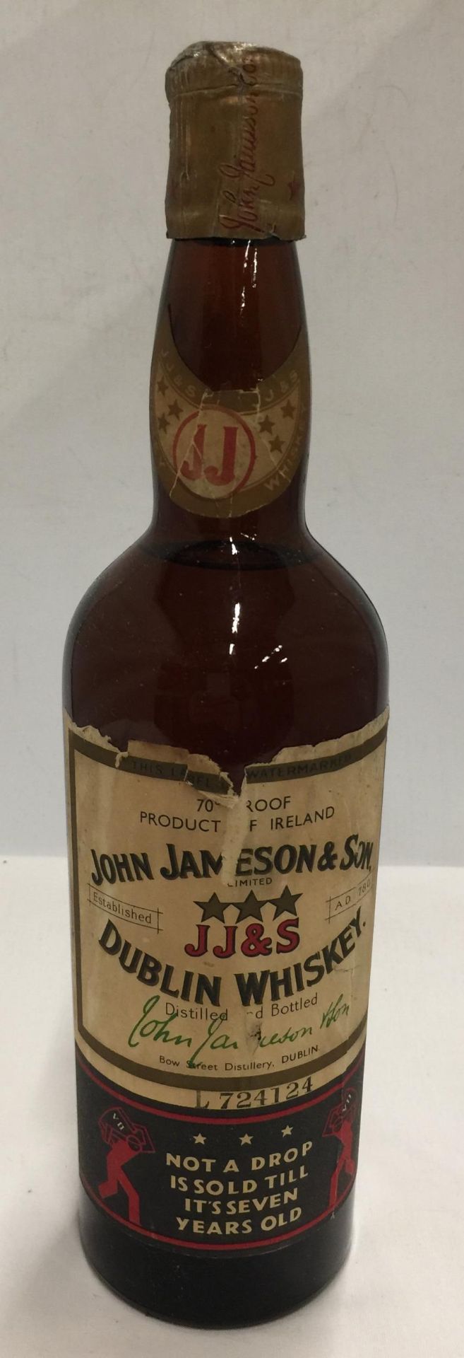 A JOHN JAMESON & SON J J & S DUBLIN WHISKEY 70 PROOF - NOT A DROP IS SOLD TILL IT'S SEVEN YEARS OLD