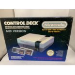 A NINTENDO ENTERTAINMENT SYSTEM CONTROL DECK NES VERSION IN BOX