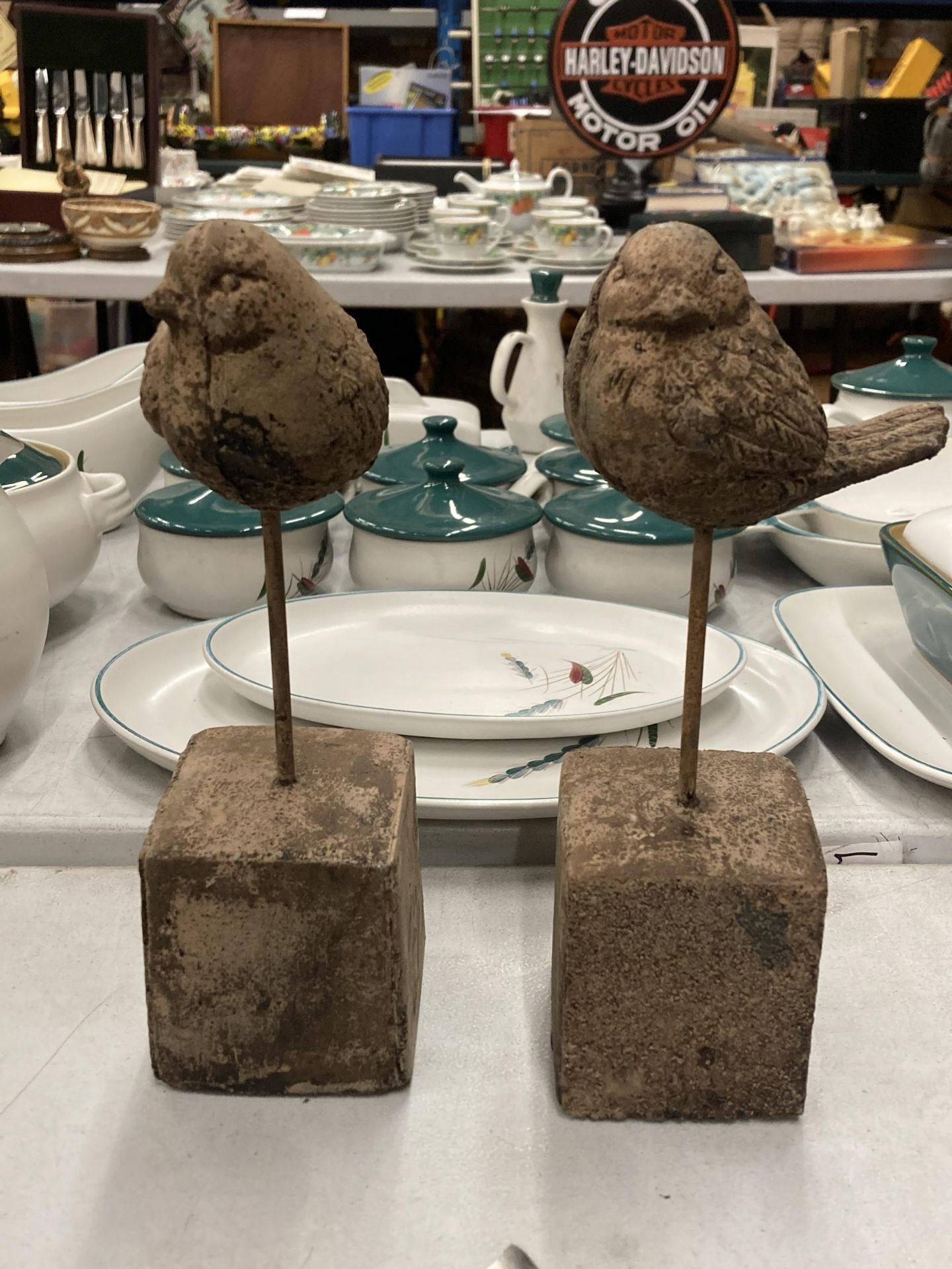 TWO DECORATIVE STONE BIRD ON PLINTH STATUES. HEIGHT 24CM