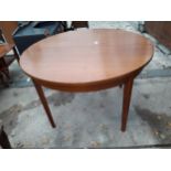 A RETRO TEAK 44.5" DIAMETER EXTENDING DINING TABLE (LEAF 14.5")