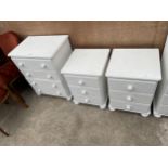 A PAINTED WHITE CHEST OF FOUR DRAWERS AND A PAIR OF BEDSIDE CHESTS