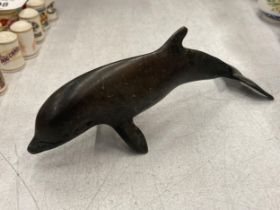 A SMALL BRONZE DOLPHIN FIGURE