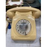 A VINTAGE CREAM DIAL UP TELEPHONE