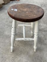 A VINTAGE PINE AND PARTIALLY PAINTED FOUR LEGGED STOOL