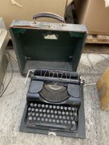 A VINTAGE TYPEWITER WITH CARRY CASE