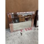 AN ART DECO UNFRAMED WALL MIRROR