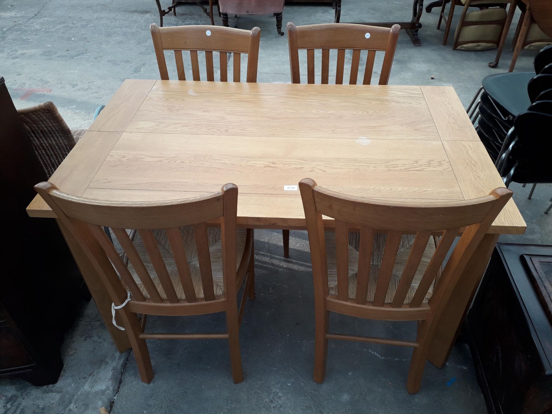 A MODERN OAK EXTENDING DINING TABLE, 52 X 32" (LEAF 19") AND FOUR RUSH SEATED CHAIRS