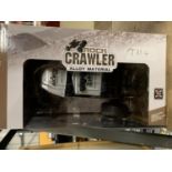 A ROCK CRAWLER REMOTE CONTROL CAR (NEW IN BOX) INCLUDES BATTERIES, CHARGER AND SIX MINI CONES