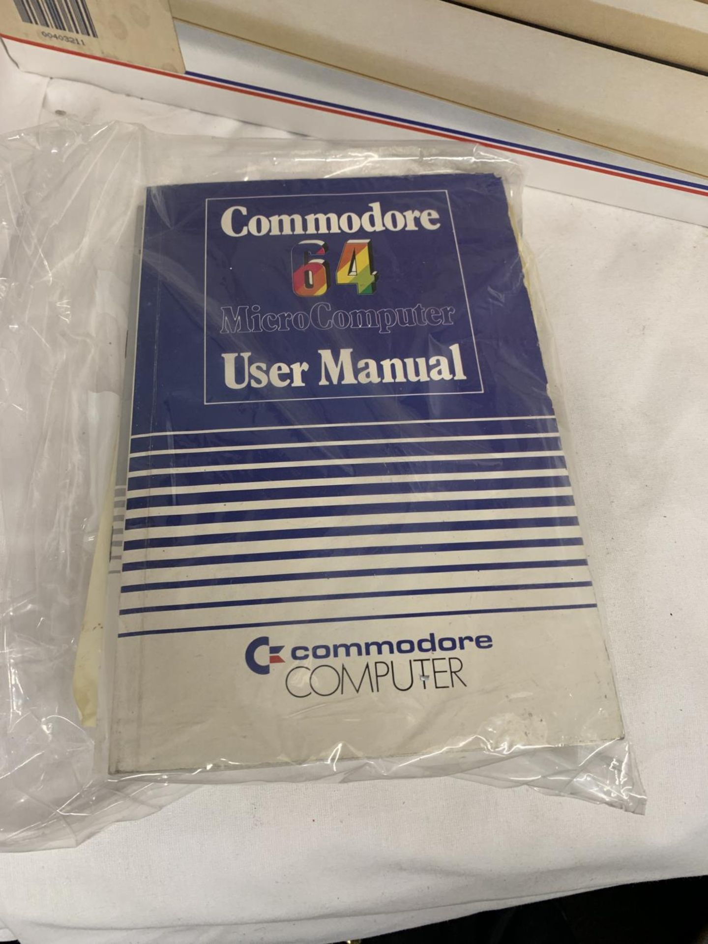 A BOXED COMMODORE 64C COMPUTER BUNDLE TO INCLUDE CASSETTE UNIT, JOYSTICK, HOLLYWOOD GAMES SUCH AS - Image 4 of 4