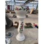 A DECORATIVE CERAMIC JARDINAIRE AND STAND