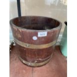 A VINTAGE OAK AND BRASS BANDED HALF BARREL COAL BUCKET