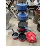 A PAN STAND WITH AN ASSORTYMENT OF PANS TO INCLUDE THREE BLUE LE CREUSET