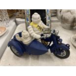 A CAST METAL MICHELIN MAN ON MOTORBIKE FIGURE