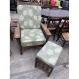 AN OAK FRAMED RECLINER CHAIR AND MATCHING STOOL