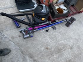 A DYSON STICK VACUUM AND A TITAN VACUUM CLEANER