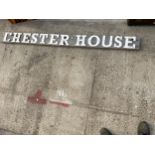 A WOODEN 'CHESTER HOUSE' SIGN