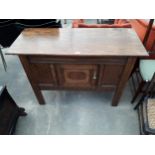 AN EARLY 20TH CENTURY OAK SIDE-CABINET WITH SINGLE DRAWER AND CARVED PANELS, 44" WIDE