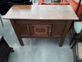 AN EARLY 20TH CENTURY OAK SIDE-CABINET WITH SINGLE DRAWER AND CARVED PANELS, 44" WIDE