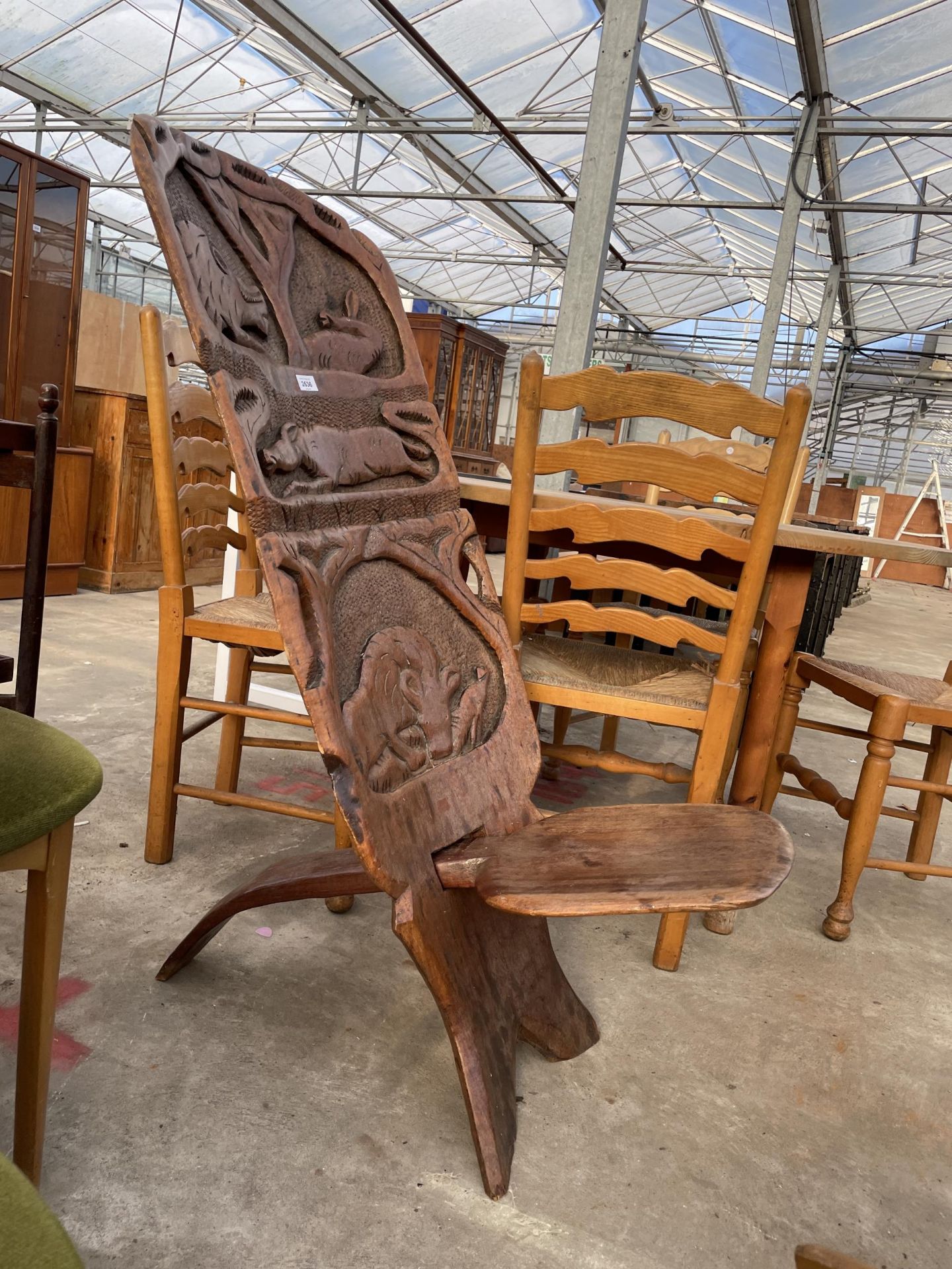 AN AFRICAN FOLDING TRIBAL CHAIR WITH WILD ANIMAL CARVINGS TO BACK - Image 2 of 4